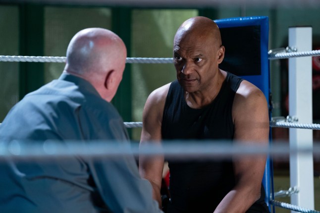 Phil Mitchell talks to George Knight in a boxing ring in EastEnders