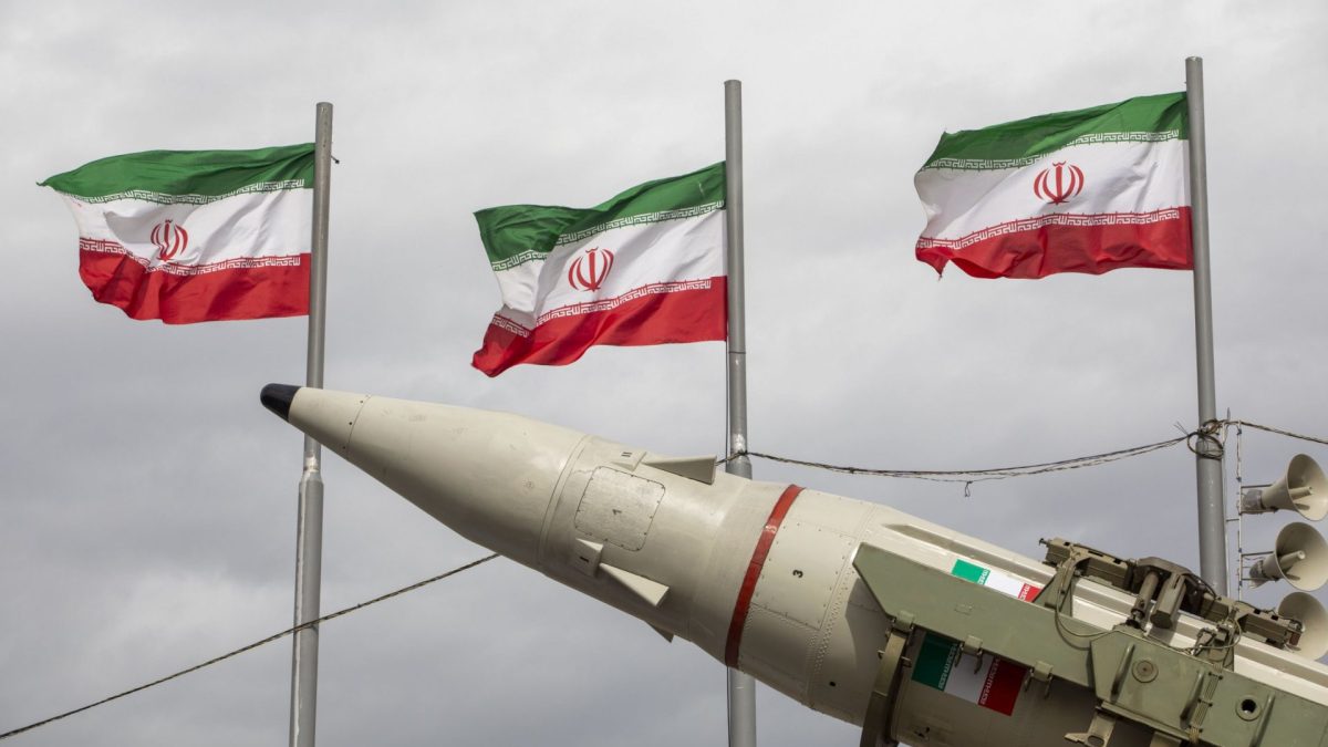 TEHRAN, IRAN - FEBRUARY 11: Missiles produced by Iran's armed forces are displayed near a row of Iranian flags during commemorations to mark the anniversary of the 1979 Iranian Revolution on February 11, 2026 in Tehran, Iran. In that year, Ruhollah Khomeini led an overthrow of the Pahlavi dynasty in 1979 and established himself as Supreme Leader of the Islamic Republic of Iran. (Photo by Majid Saeedi/Getty Images)
