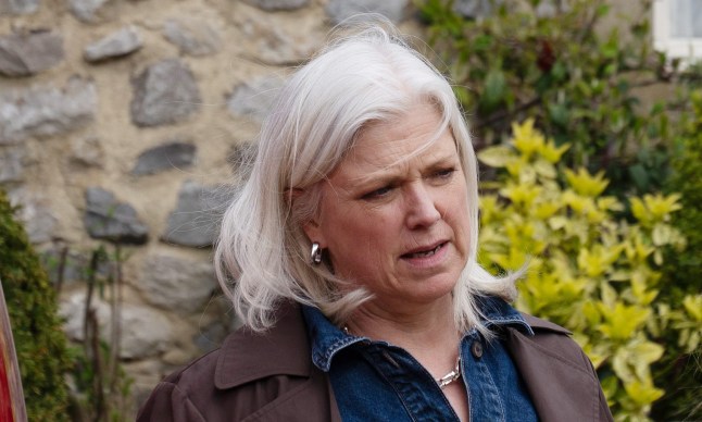 Doctor Todd standing in the village looking annoyed in Emmerdale