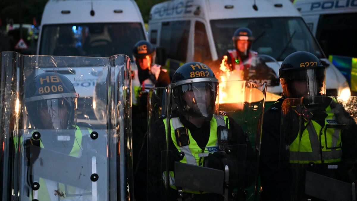 SOUTHAMPTON, ENGLAND - JUNE 2: Riot police stand guard as protesters gather near the location where Henry Nowak died during a demonstration over the Police's handling of the incident, on June 2, 2026 in Southampton, England. Far-right and nationalist groups have actively organised demonstrations and vigils following revelations from the ongoing murder trial of 18-year-old student Henry Nowak. The case involves the fatal stabbing of Nowak in Southampton in December 2025 by Vickrum Digwa. Court details revealed that Digwa falsely claimed to arriving officers that he was the victim of a racist attack, leading responding police to temporarily handcuff the fatally wounded teenager before discovering his injuries. (Photo by Finnbarr Webster/Getty Images)