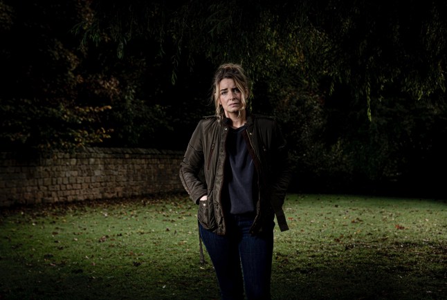 An Emmerdale press photo that features Charity Dingle standing in the dark looking traumatised