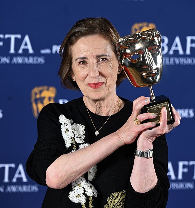 LONDON, ENGLAND - MAY 11: Kirsty Wark poses with the Fellowship Award inside the Winners Room at the 2025 BAFTA Television Awards with P&O Cruises at The Royal Festival Hall on May 11, 2025 in London, England. (Photo by Stuart C. Wilson/Getty Images)