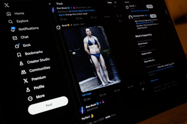 LONDON, ENGLAND - JANUARY 12: In this photo illustration, a screen displays a post by Elon Musk on the X app, showing an AI prompt-created image, made with Xai's Grok app, depicting Musk wearing a bikini, on January 12, 2026 in London, England. Today the UK communications regulator Ofcom launches a formal investigation into Elon Musk's social media platform X regarding its AI chatbot, Grok.??The probe centres on reports that Grok has been used to generate non-consensual sexual deepfakes, including "undressed" images of women and sexualised images of children. (Photo by Leon Neal/Getty Images)