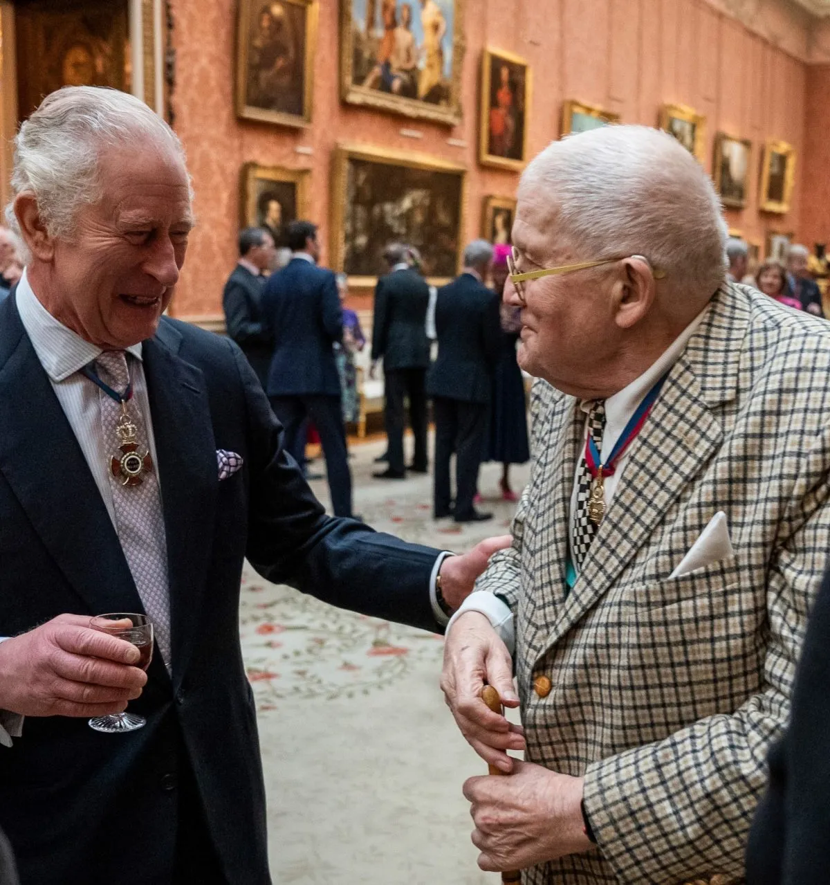 FILE - Britain's King Charles III talks with artist David Hockney during a luncheon for Members of the Order of Merit at Buckingham Palace in London, Thursday, Nov. 24, 2022. (Aaron Chown/Pool via AP, File)
