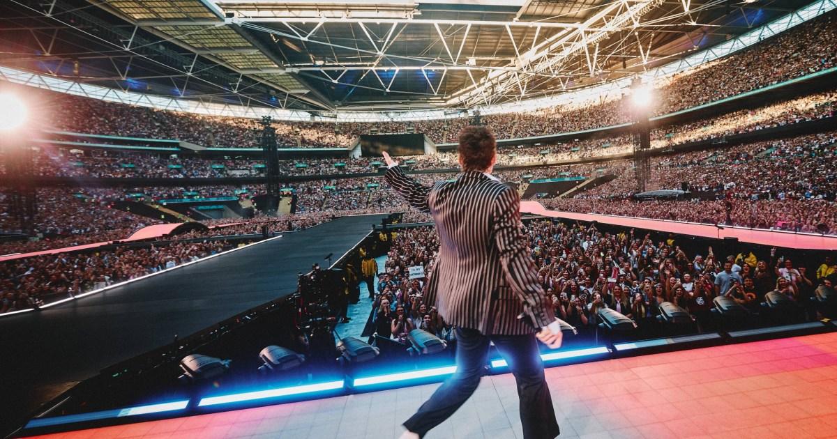 Harry Styles stops Wembley gig mid-song to help 'distressed' fan