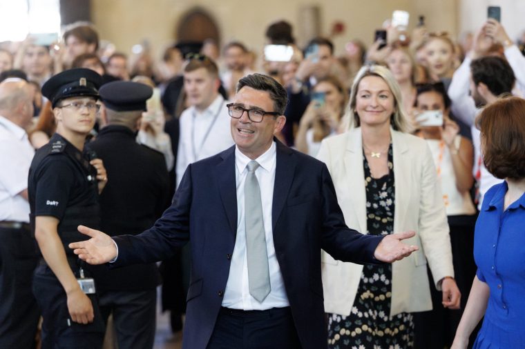 LONDON, ENGLAND - JUNE 22: Andy Burnham, Labour MP for Makerfield, celebrates after his swearing-in at the Houses of Parliament on June 22, 2026 in London, England. Last week Andy Burnham won 54% of the vote in the Makerfield by-election, paving his way to return to Westminster as an MP and challenger to Prime Minister Keir Starmer's leadership. (Photo by Dan Kitwood/Getty Images)