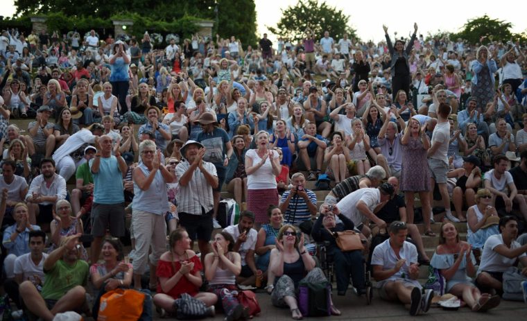 Spectators fill Henman Hill (Murray Mount) as they watch Britain's Andy Murray plays against Italy's Fabio Fognini, on the big screen at The All England Lawn Tennis Club in Wimbledon, southwest London, on July 7, 2017 on the fifth day of the 2017 Wimbledon Championships. Murray won the match 6-2, 4-6, 6-1, 7-5. / AFP PHOTO / Oli SCARFF / RESTRICTED TO EDITORIAL USE (Photo credit should read OLI SCARFF/AFP via Getty Images)