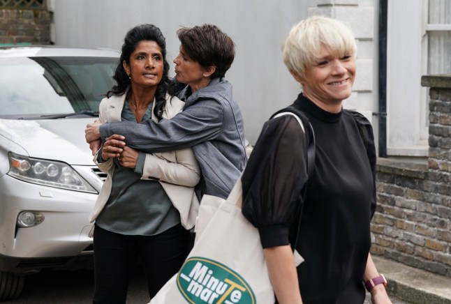 Suki is held back by Eve as a grinning Nicola walks away in EastEnders