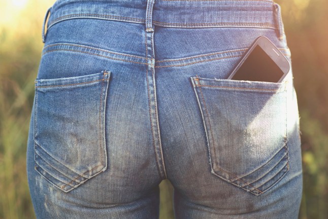 Woman carrying smartphone in back pocket