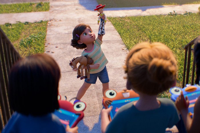 TOY STORY 5 Bonnie from Toy Story 5 plays with her Jessie cowgirl doll and Bullseye horse toy as three girls look at her playing on tablets