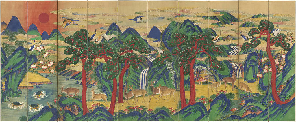 a folding screen covered in an ornate painting