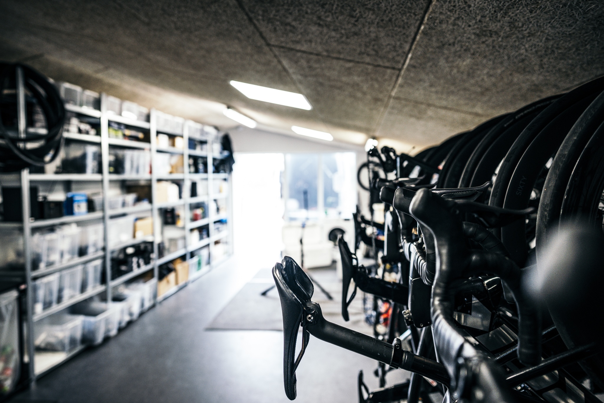 A store room full of hanging bikes