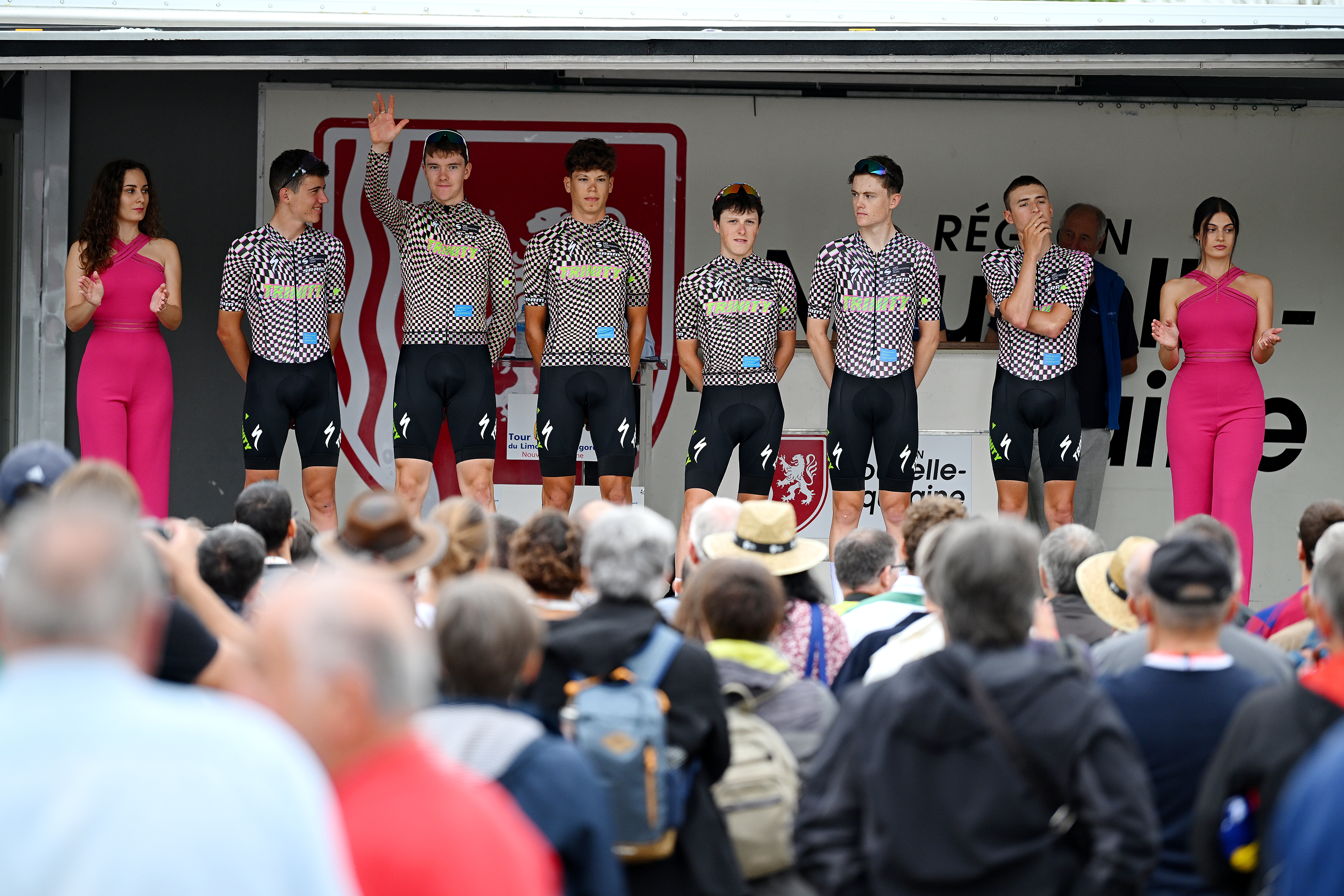 Trinity Racing riders stand on the podium before a road race