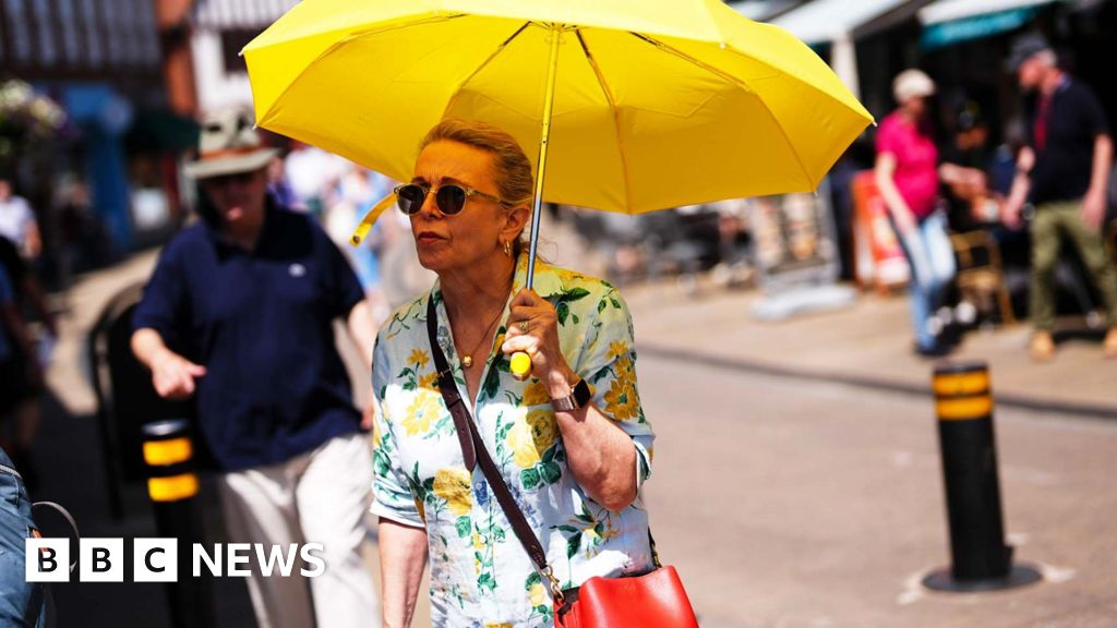 Temperatures could hit 40C in UK as rare red heat warning issued - BBC
