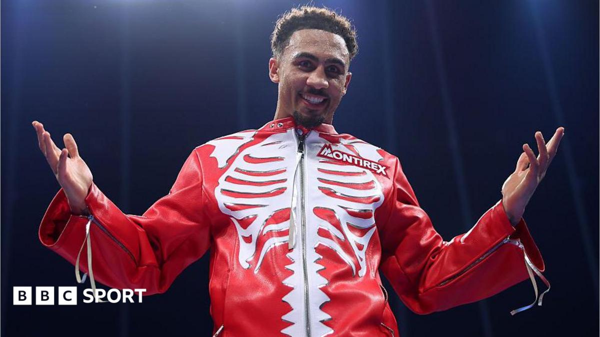 Ben Whittaker wearing a red jacket with a white skeleton pattern on the chest