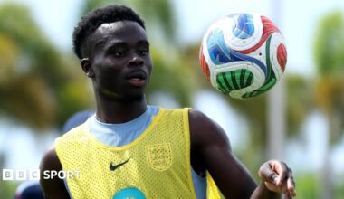 Bukayo Saka tosses a football in the air during an England training session in Florida