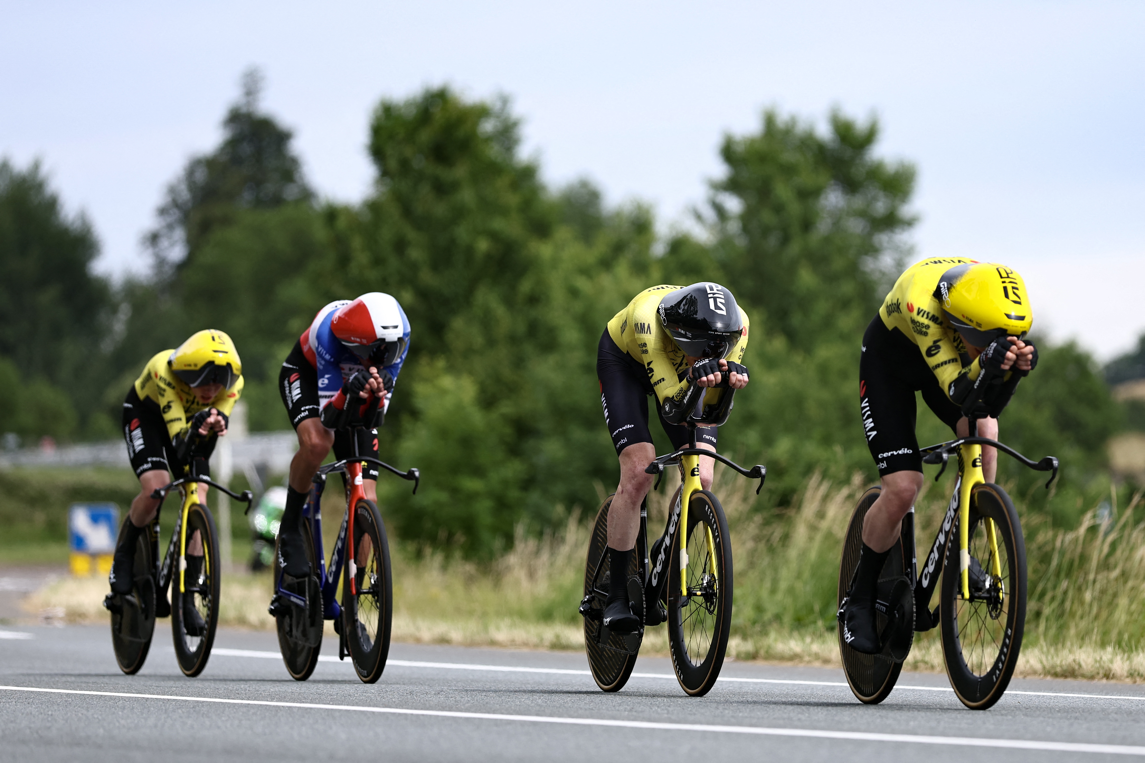 Team Visma | Lease a Bike's team riders cycle during the 3rd stage of the Tour Auvergne-Rhone-Alpes cycling race (formerly known as the Criterium du Dauphine), 28,4km team time trial departing and arriving in Perreux central France, on June 9, 2026. (Photo by Anne-Christine POUJOULAT / AFP via Getty Images)
