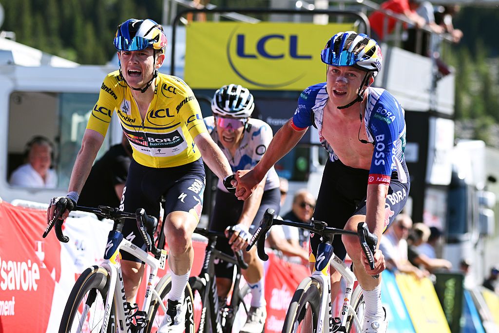 BRISON, FRANCE - JUNE 14: (L-R) Luke Tuckwell of Australia, loses the Yellow leader jersey and Maxim Van Gils of Belgium and Team Red Bull - BORA - hansgrohe cross the finish line during the 78th Tour Auvergne-Rhone-Alpes 2026, Stage 8 a 120.1km stage from Beaufort to Plateau de Solaison - Brison 1497m / #UCIWT / on June 14, 2026 in Brison, France. (Photo by Dario Belingheri/Getty Images)