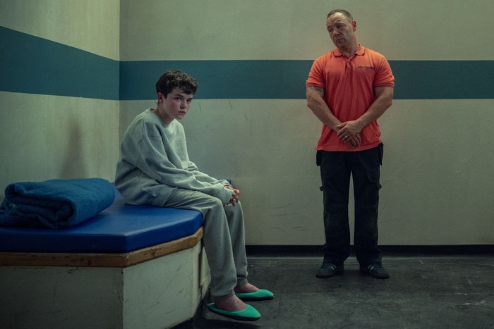 adolescence Owen Cooper and Stephen Graham as Jamie and Eddie Miller in Adolescence. They are in a prison cell, looking ahead.