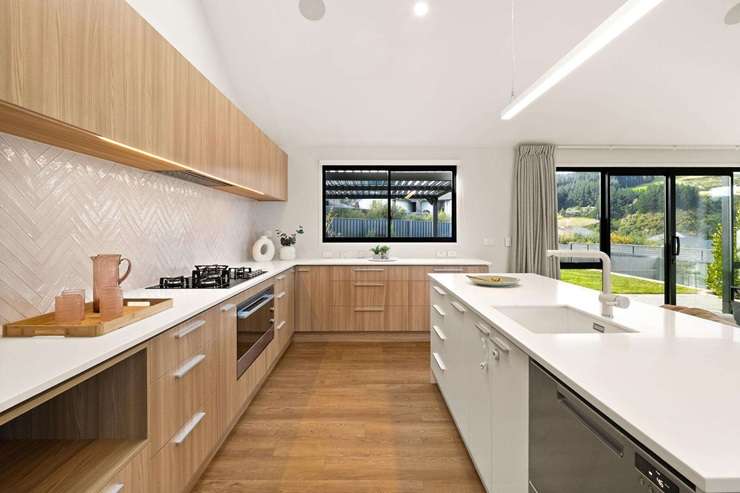 Black Caps bowler Jacob Duffy and his wife Tash love their home at 5 Goddard Way, in Sawyers Bay, but they need to move closer to family now that they have a newborn baby. Photo / Supplied