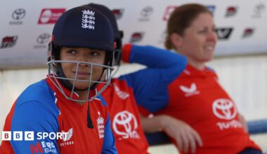 Sophia Dunkley looks on, with her helmet on, while waiting to bat