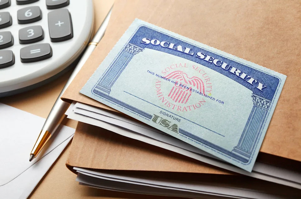 A Social Security atop of a stack of file folders.
