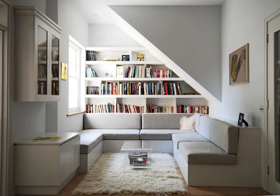 A built-in bookcase and relaxed seating area turn this living space into an inviting reading retreat