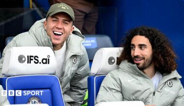 Enzo Fernandez joking with Marc Cucurella on Chelsea's bench