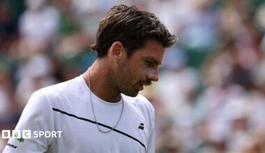 Cameron Norrie looks down during his first-round match at Wimbledon