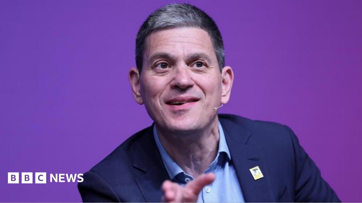 David Miliband speaking on stage