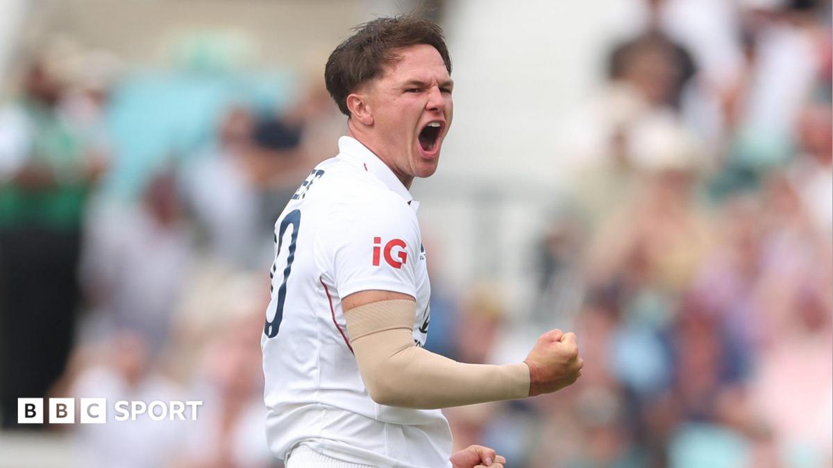 Sonny Baker and Kyle Abbott speak on the cricket field during a County Championship match