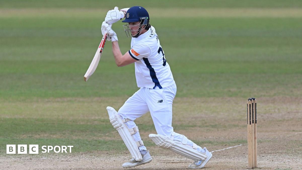 Left-handed Hampshire opener Ali Orr plays off-drive, wearing whits and Hampshire blue club helmet.