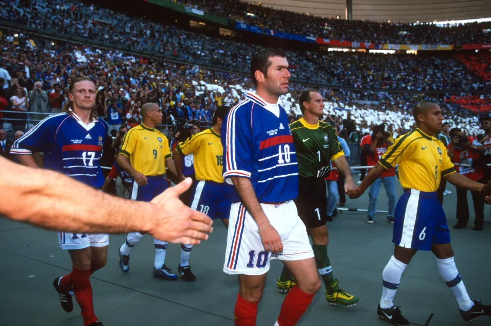 Zinedine Zidane walks out onto the pitch before the 1998 World Cup final between France and Brazil