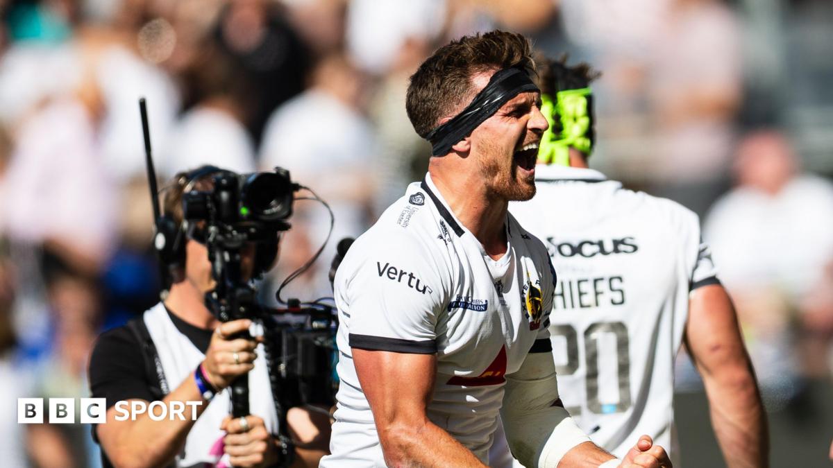 Henry Slade clenches his fist and has his mouth open in celebration