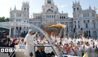 Pope Leo XIV waves to faithful from his popemobile