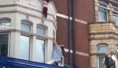 Terrifying moment child hangs to ledge above London shop before dramatic rescue - London Evening Standard