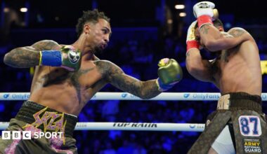 Great Britain's Ben Whittaker punches Richard Rivera during their light-heavyweight bout in Brooklyn