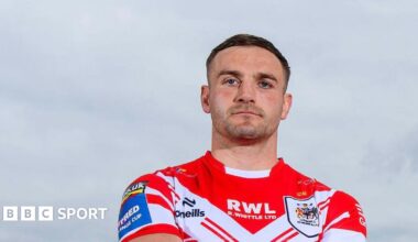 Matty Lees stands during a press shot before St Helens' Challenge Cup semi-final against Wigan Warriors