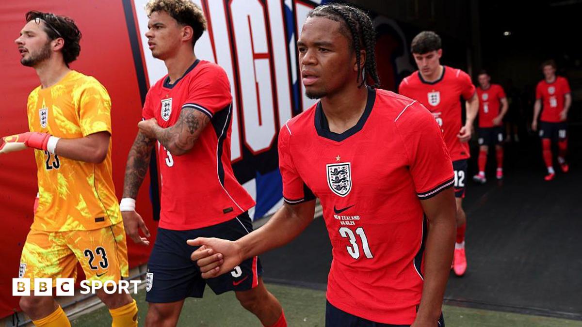 Ngumoha, wearing a red England shirt, walks out of the tunnel for the second half of their game against New Zealand