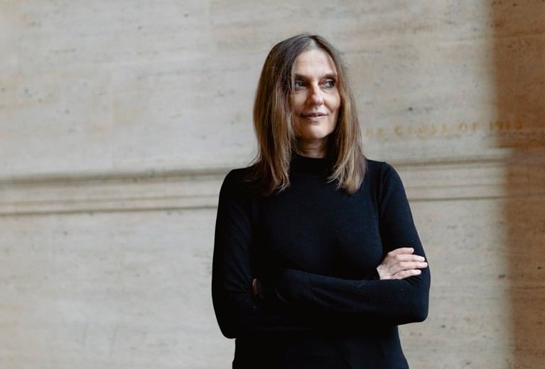 Portrait of Regina Barzilay standing with her arms folded.