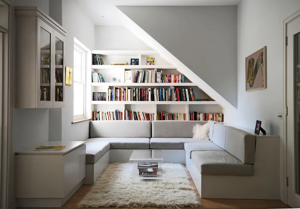 A built-in bookcase and relaxed seating area turn this living space into an inviting reading retreat, creating a quiet spot to switch off (Alex Find