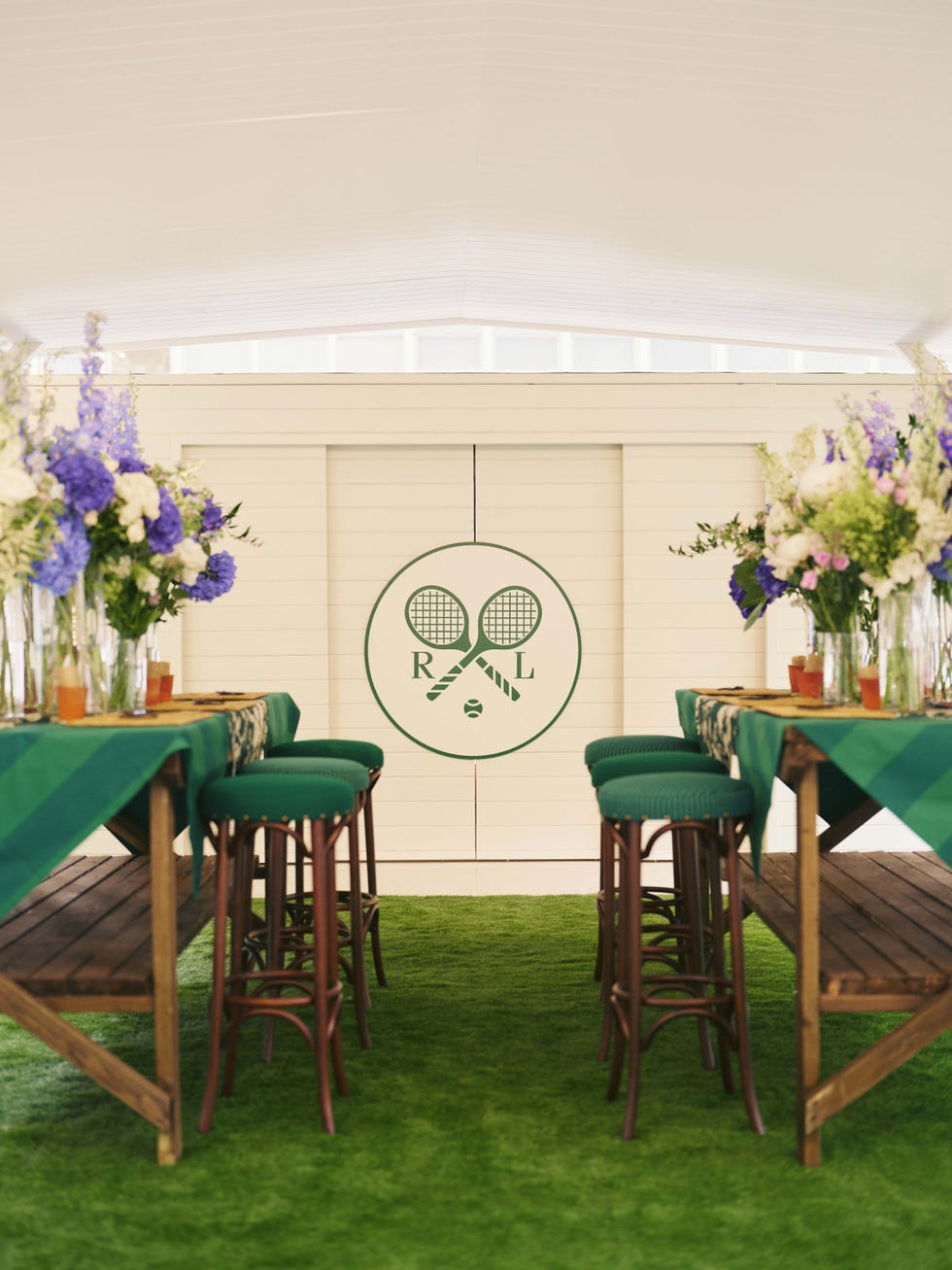 Elegant dining area with green decor and floral arrangements. Elegant dining area with green decor and floral arrangements.