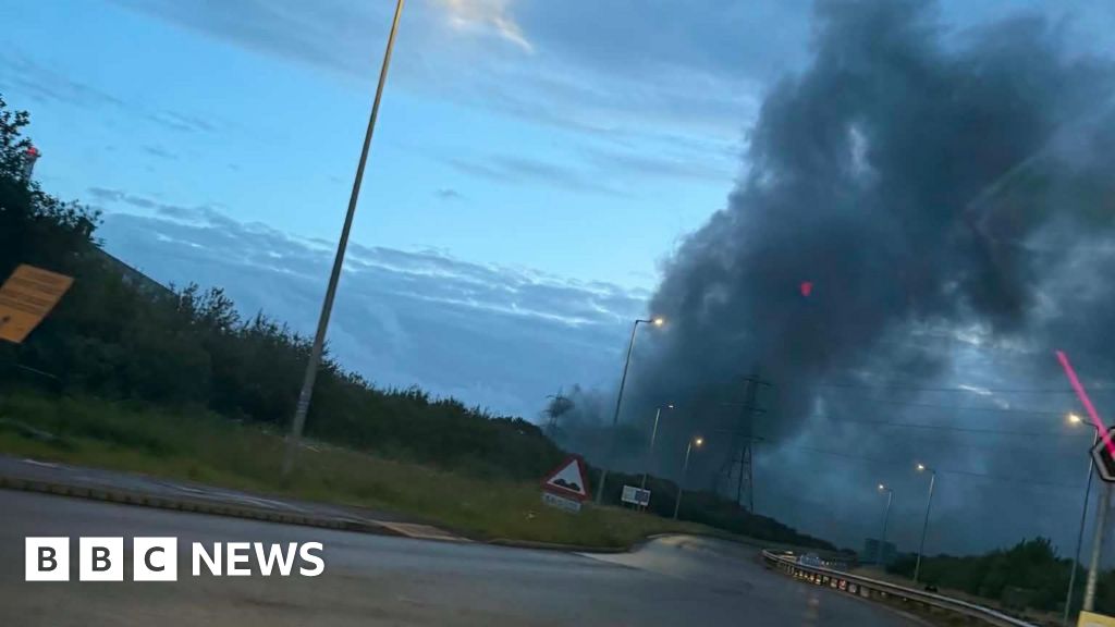 Crews tackling fire with 'large plumes of smoke' at Tata Steel - BBC