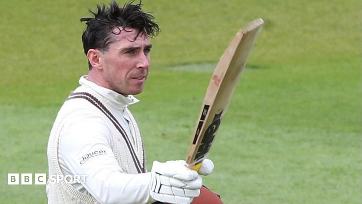 Dan Lawrence raises his bat