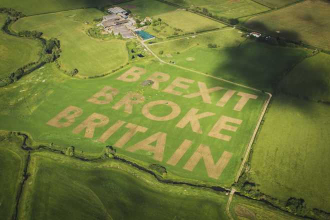 Led By Donkeys Campaigners Write Field Message To Mark Brexit's 10th Anniversary An aerial view as activists from the Campaign group Led By Donkeys use a tractor and harrow to carve "BREXIT BROKE BRITAIN" in giant letters on June 19, at a field in Castle Eaton, near Swindon, England. June 23 marks ten years since the UK voted in a slim majority to leave the European Union.