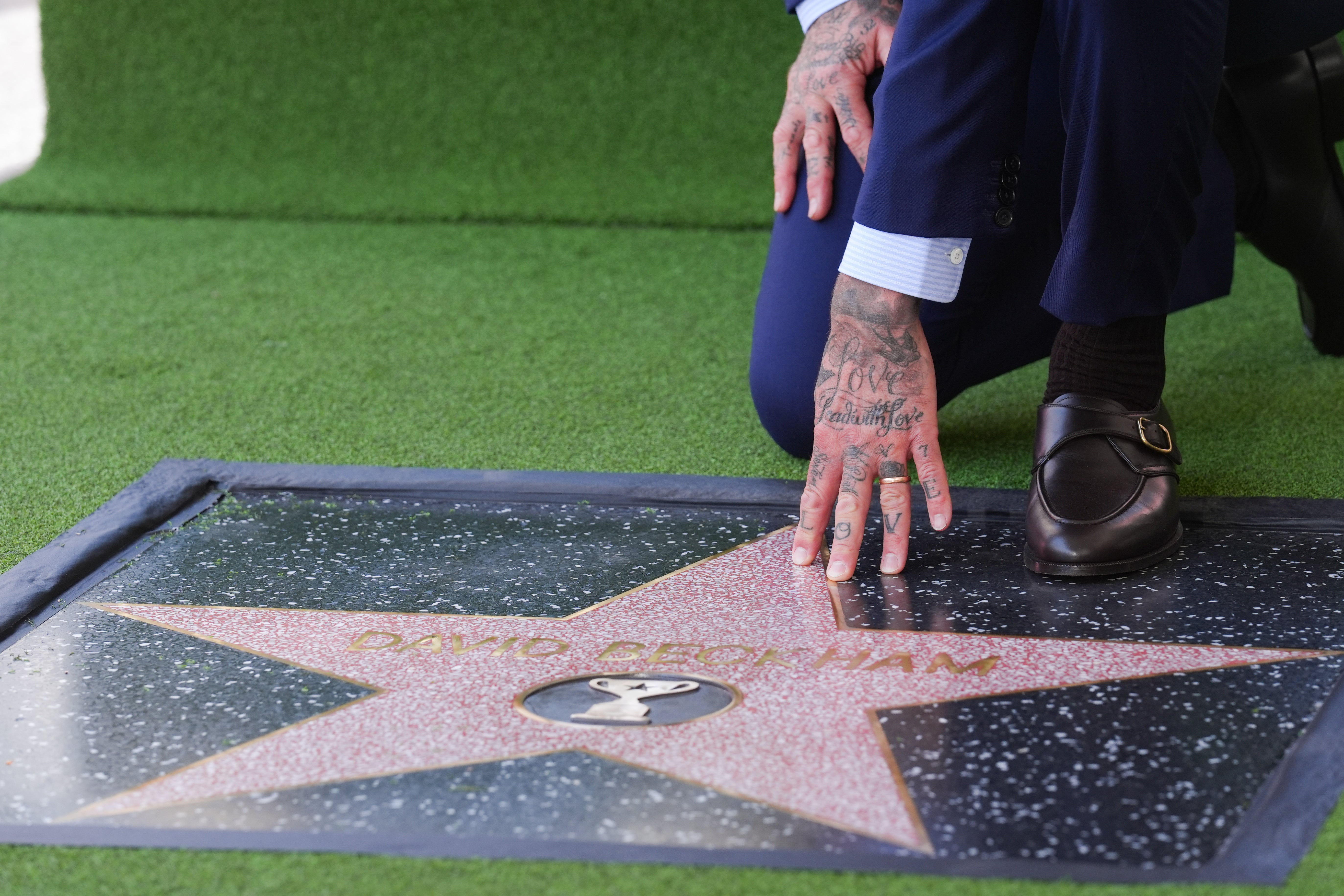 Beckham touches his Walk of Fame star