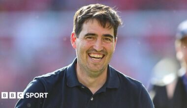 Bournemouth boss Andoni Iraola smiles on the touchline