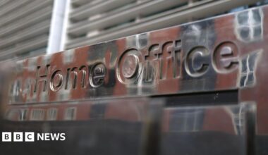 Exterior shot of a 'Home Office' sign.
