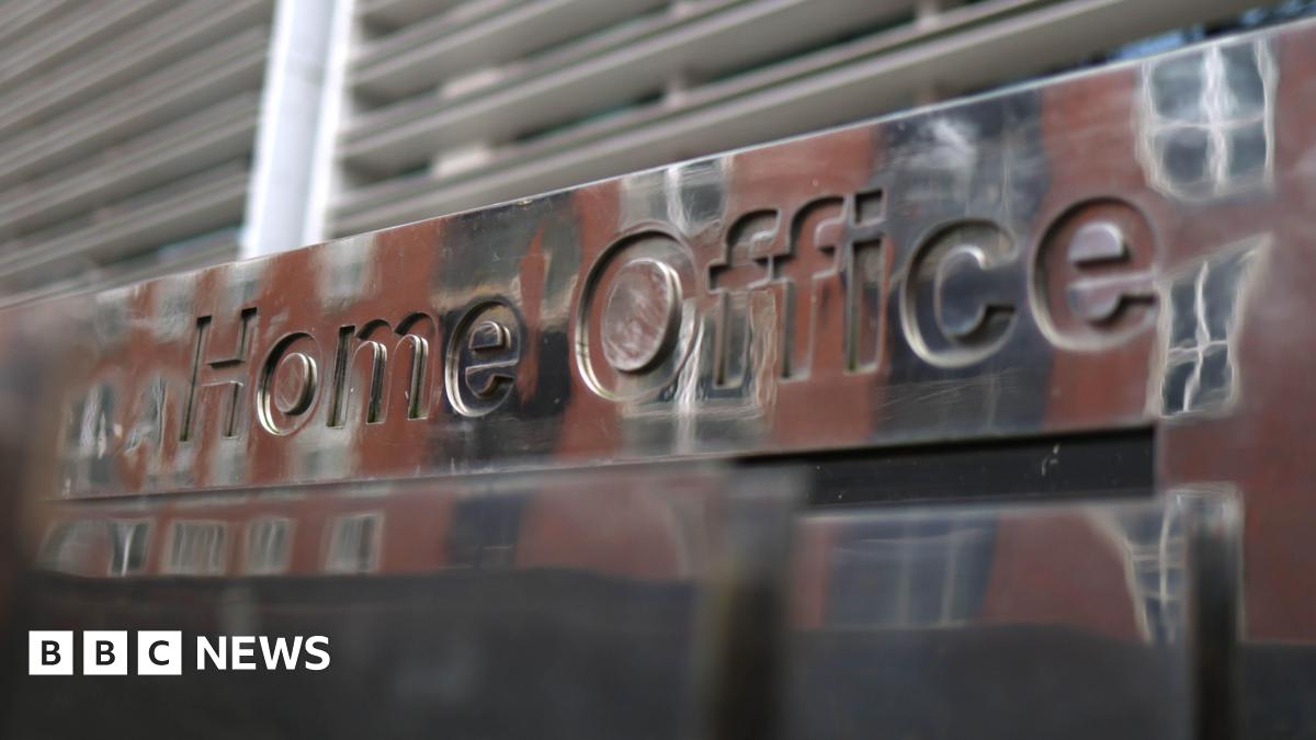 Exterior shot of a 'Home Office' sign.