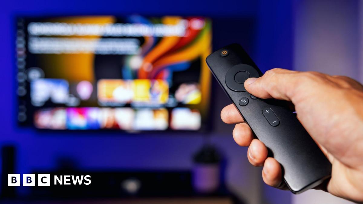 TV remote pointed at TV with streaming services